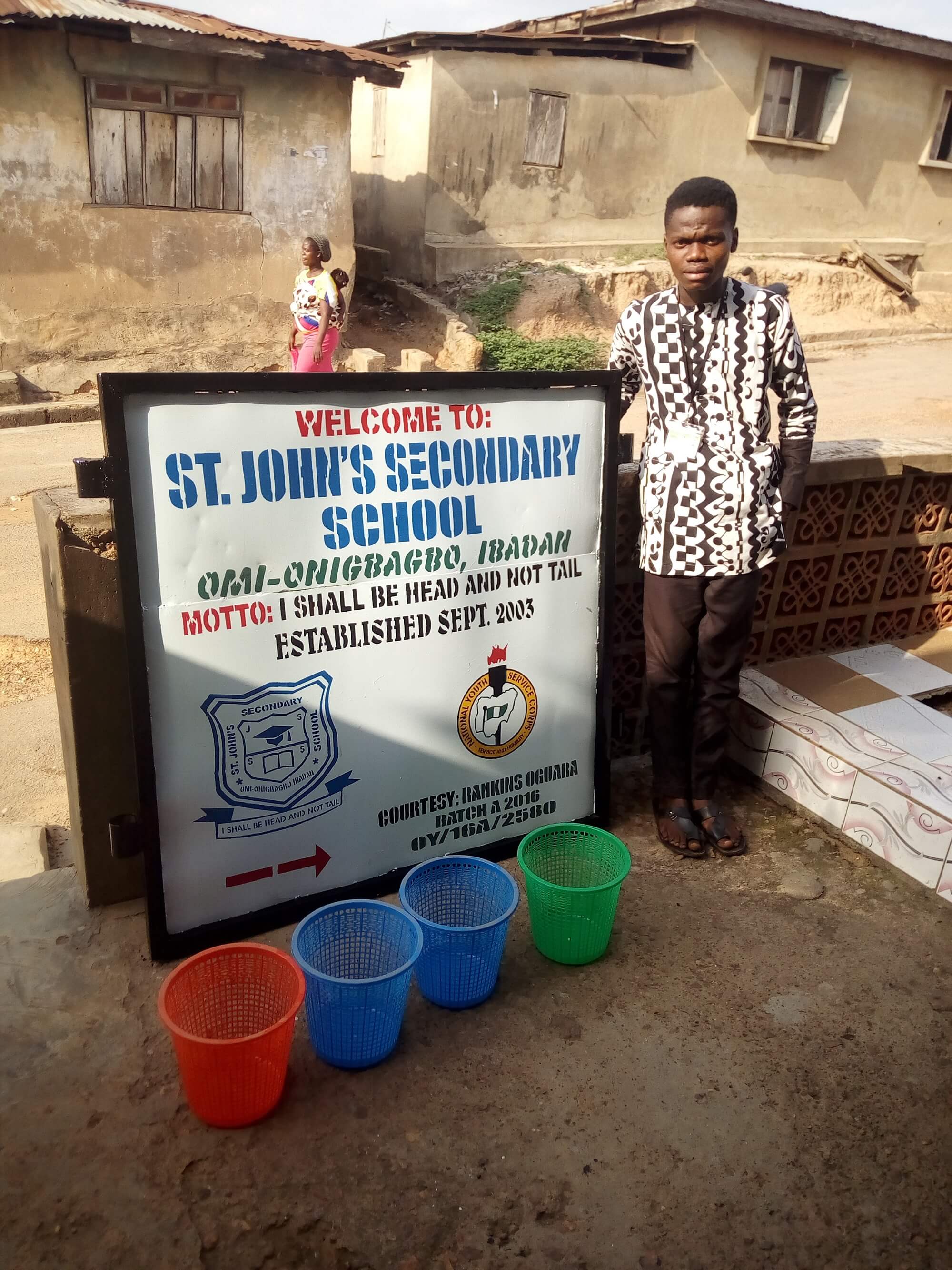 Oguara Rankins constructs signpost for school, donates trashbin